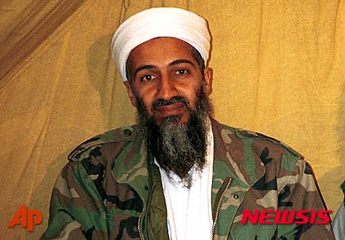 FILE - In this undated file photo Osama bin Laden is seen in Afghanistan. In his last will and testament, bin Laden claimed he had about $29 million in personal wealth, the bulk of which he wanted to be used "on jihad, for the sake of Allah." The will was released Tuesday, March 1, 2016, in a batch of more than 100 documents seized in a May 2011 raid that killed bin Laden at his compound in Abbottabad, Pakistan.  (AP Photo)