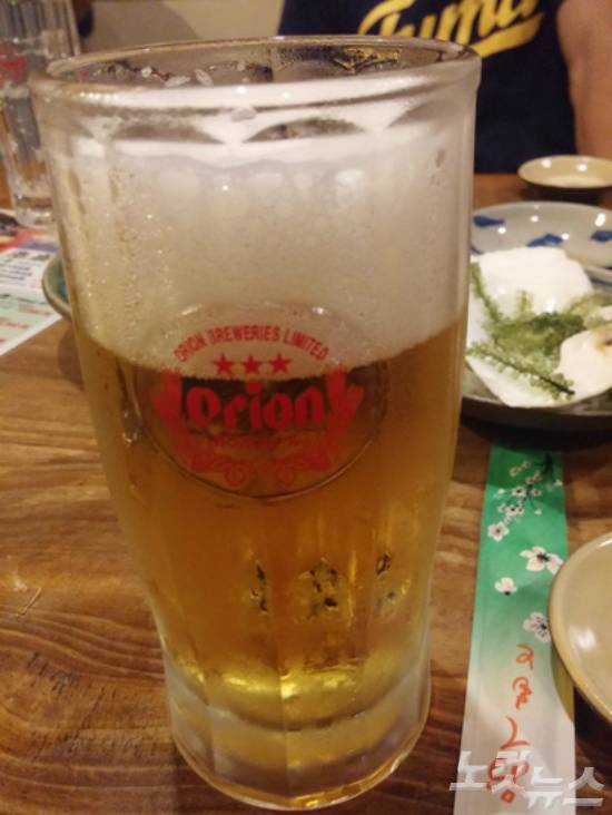 파야오의 오키나와 전통요리와 함께 곁들이면 최고인 오리온 맥주. (사진=재패니안 제공)