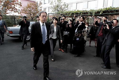 Junichi Ihara, director general of the Asia and Oceania Affairs Bureau of Japan's Foreign Ministry, arrives at the Special Investigation Committee office to hold a meeting on abduction probe with North Korean officials in Pyongyang, North Korea, Wednesday, Oct. 29,  2014. The second and final day of talks was underway Wednesday between North Korean and Japanese officials assessing progress into an investigation of the fates of Japanese citizens abducted by North Korea in the 1970s and '80s. The abduction issue has long been a major obstacle in the frosty ties between the two nations, which have no formal diplomatic relations. (AP Photo/Kim Kwang Hyon)