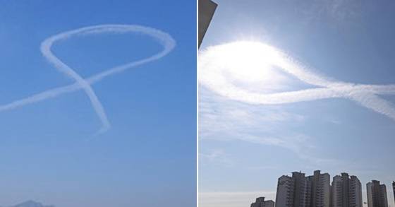 26일 강원도 춘천시 도심 상공에 나타난 세월호 리본을 닮은 구름 [연합뉴스]