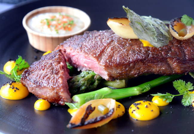 Ferment B pairs a sous-vide and seared striploin steak with “nuruk” salt -- a fermented condiment that packs a saline punch, a rich sweetness and a wallop of umami (Photo credit: Park Hyun-koo/The Korea Herald)