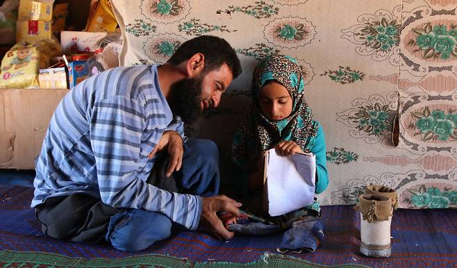 ³¹Î Ä·ÇÁ¿¡¼ »ýȰÇÏ´Â ¸¶¾ß ºÎ³à. AFP¿¬ÇÕ´º½º