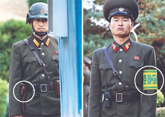 오른쪽 사진은 남북 장성급회담이 열린 10월 26일 판문점 북측에서 비무장 조치 후 근무 중인 북한군모습. 철모와 권총(왼쪽 원 안)을 찼던 과거 모습(왼쪽 사진)과 달리 권총은 없고 ‘판문점 민사경찰 27’이라는 완장(오른쪽 원 안)을 차고 있다. [사진공동취재단]