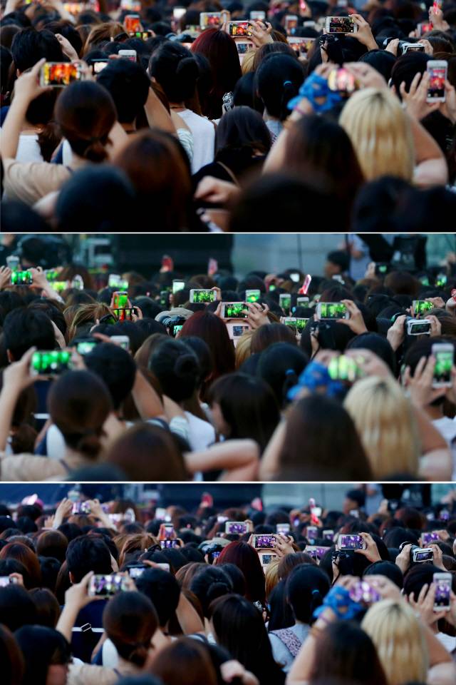 이제 직캠은 아이돌 문화에서 없어서는 안 될 요소로 꼽힌다. 사진은 앨범 발매 쇼케이스에서 팬들이 카메라로 공연을 담고 있는 모습. /연합뉴스