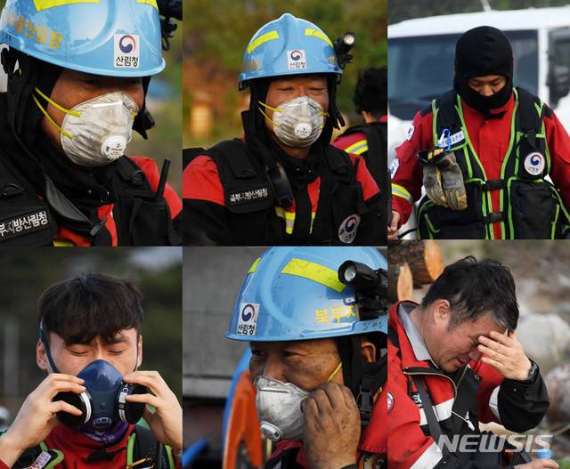 [서울=뉴시스] 고범준 기자 = 2일 오전 강원도 고성군 토성면 도원리 일원에서 밤새 산불 진화 작업을 벌인 산림청 산불진화대원들이 지친 표정을 짓고 있다. (사진=산림청 제공) 2020.05.02. photo@newsis.com
