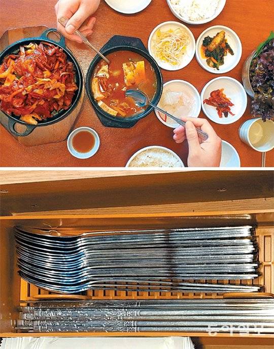 서울의 한 백반집 상차림 모습(위 사진). 이처럼 일부 식당에는 아직도 국자 없이 찌개를 내오는 곳이 있다. 특히 반찬을 한 그릇에 담아 제공하는 건 대부분의 식당에서 볼 수 있다. 수저가 빽빽하게 들어있는 수저통(아래 사진)도 꺼낼 때 여러 사람이 만지다 보니 위생에 취약하다. 자칫 손에 묻은 비말이 수저에 묻을 수도 있다. 신지환 기자 jhshin93@donga.com