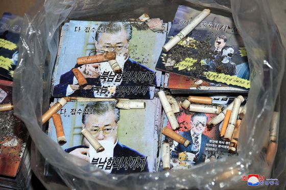 A photo released by the North's state-run Korean Central News Agency on Saturday, showing cigarette butts in a bag full of leaflets made by the regime condemning South Korean President Moon Jae-in. The North announced it will be dispatching such propaganda fliers toward the South in the near future. [YONHAP]