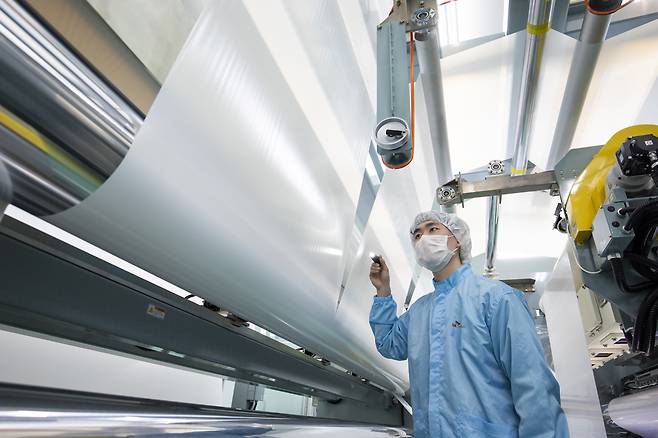 An SKIET official checks the quality of the company’s separators. (SKIET)