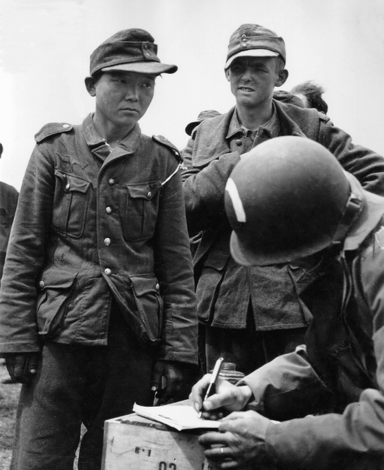 An Asian soldier captured in Normandy by the allied forces during WWII. The man is thought to be Yang Kyoung-jong. [PUBLIC DOMAIN]