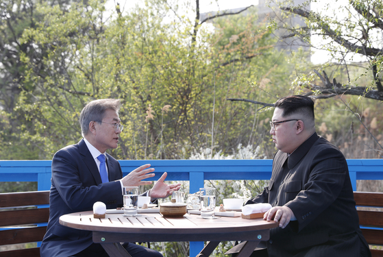 In this file photo, President Moon Jae-in, left, talks to North Korean leader Kim Jong-un in a one-on-one dialogue as part of the inter-Korean summit in Panmunjom on April 27, 2018.