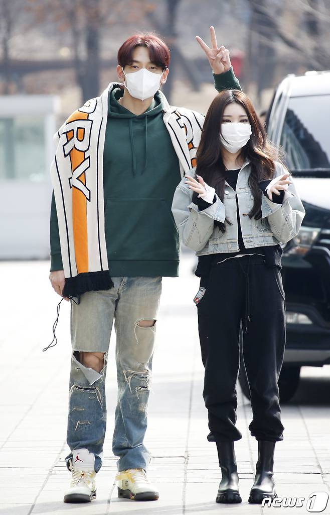 Seoul: = Singers Rain and Cheongha (right) greet each other as they enter the broadcasting station to appear on SBS`s Dooshi Escape Cult show at SBS building in Mok-dong, Yangcheon district, Seoul on the 3rd. 2021.3.3