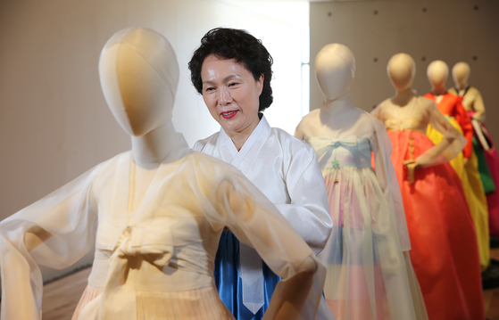 Hanbok, or traditional Korean dress, designer Kim Hye-soon checking on mannequins wearing her work. Her hanbok is on display in the exhibit “Dialogue” at Kim Byung Jong Art Museum in Namwon, North Jeolla, until May 9. [JANG JUNG-PIL]