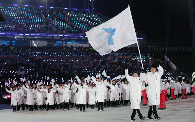 Select athletes and Olympic officials of the two Koreas enter the PyeongChang Olympic Stadium in PyeongChang, at the Olympics' opening ceremony on Feb. 9, 2018 (Yonhap)