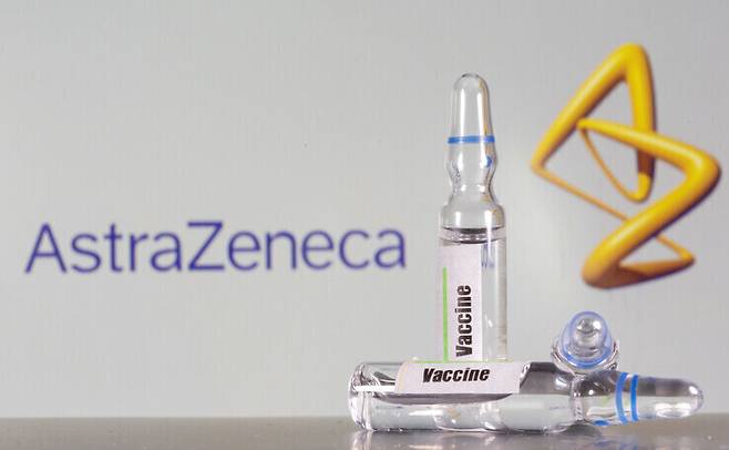 The photo shows a test tube labeled “Vaccine” in front of the AstraZeneca logo. (Reuters/Yonhap News)