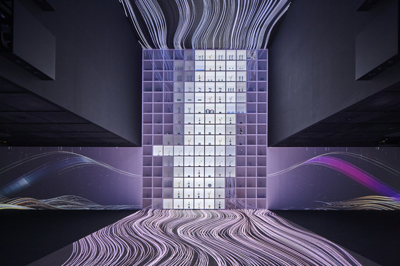 The ″HYBE Music″ section is a room with light projected onto the walls, ceiling and floor, to give an overwhelming visual experience as if stepping into a whole new digital world. A 7-minute video on the history of HYBE and its artists is played, during which an 8.5-meter- (28-foot)-high wall filled with trophies earned by HYBE’s artists is lighted. [HYBE]