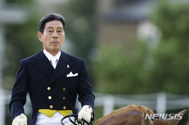 [런던=AP/뉴시스]만 71세의 나이로 2012년 런던올림픽에 출전한 일본 승마선수 호케츠 히로시. 2012.08.03.