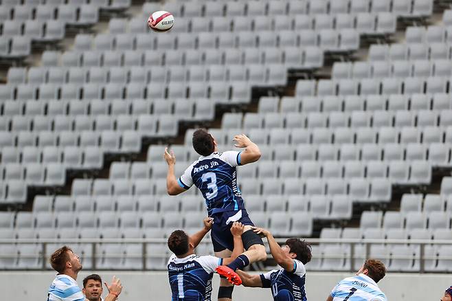 Andre Jin Coquillard of South Korea jumps for the ball during a group stage match against Argentina on Tuesday. (pool photo)