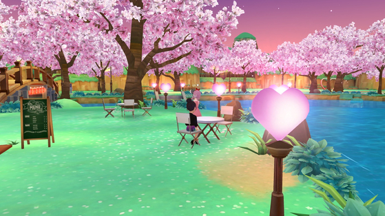 A user looks at cherry blossoms in a virtual park produced within Naver Z's Zepeto metaverse. [SCREEN CAPTURE]