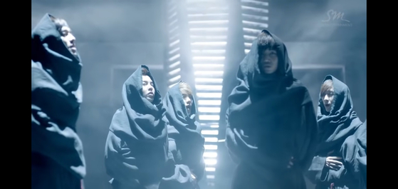 Exo's debut music video "Mama" (2012) shows members wearing robes reminiscent of "medieval friars" according to Chammah J. Kaunda, a professor of theology at Yonsei University. [SCREEN CAPTURE]