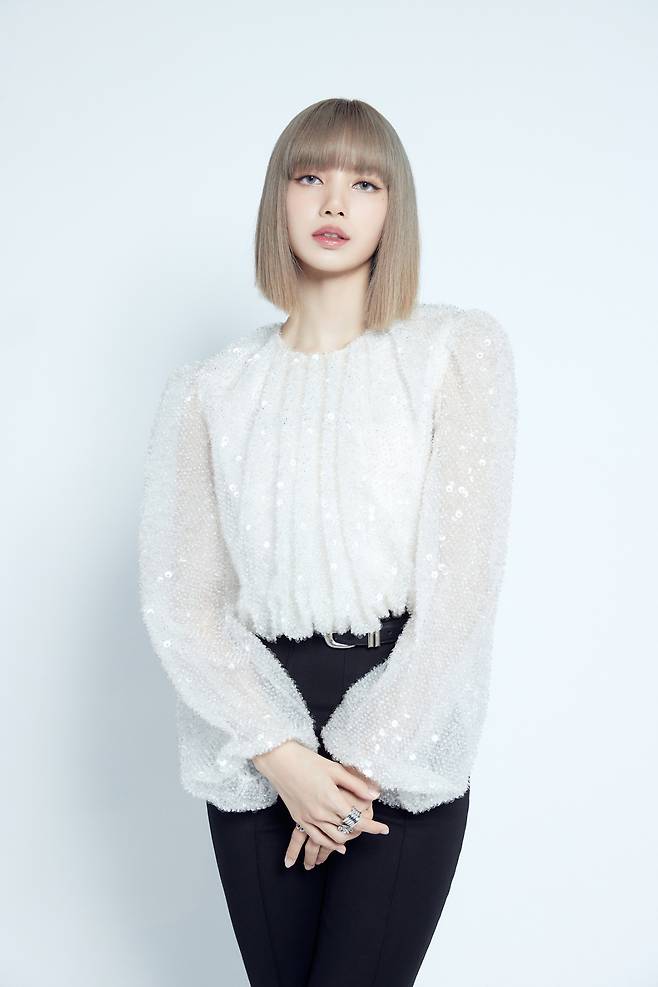 Lisa poses during an online press conference Friday. (YG Entertainment)