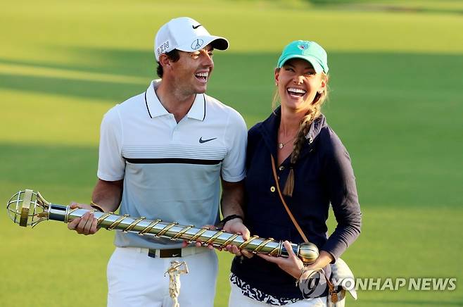 로리 매킬로이와 에리카 스톨 [EPA=연합뉴스 자료사진]