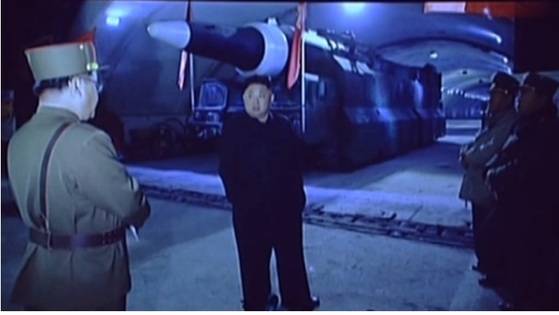 2017년 7월 북한 조선중앙TV가 공개한 '화성-14' 미사일 시험발사 성공 기념공연 무대 배경에서는 김정은 북한 국무위원장이 갱도로 보이는 지하 시설 내부에서 군수 분야 관계자들과 이야기를 나누는 모습의 사진이 등장했다. 조선중앙TV