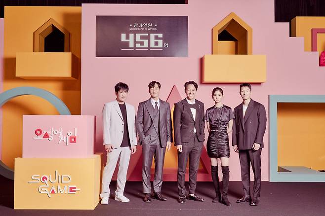 From left: Actors Heo Sung-tae, Park Hae-soo, Lee Jung-jae, Jung Ho-yeon and Wi Ha-joon pose for a photo after an online press conference on Sept. 15. (Netflix)