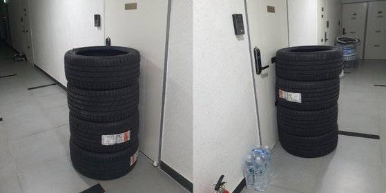 문 앞에 배송된 타이어 4개. [온라인 커뮤니티 ‘보배드림’ 캡처]