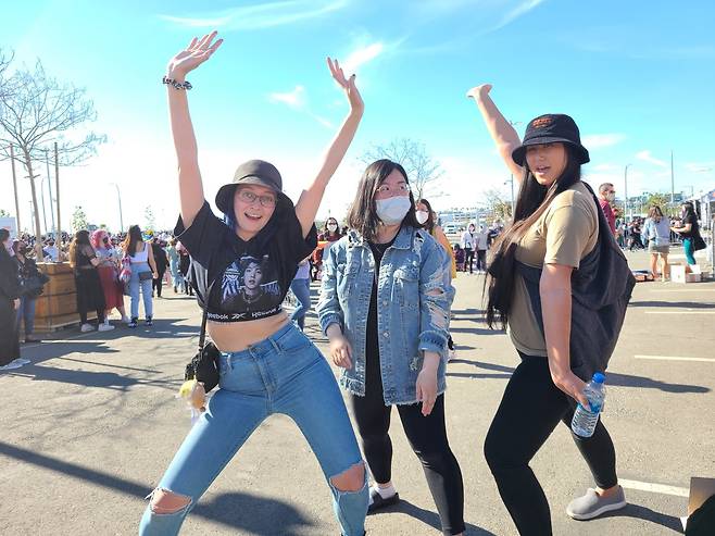 (From left) Alexa, Jess and Brita pose for a picture after buying concert merchandise at SoFi Stadium on Friday.