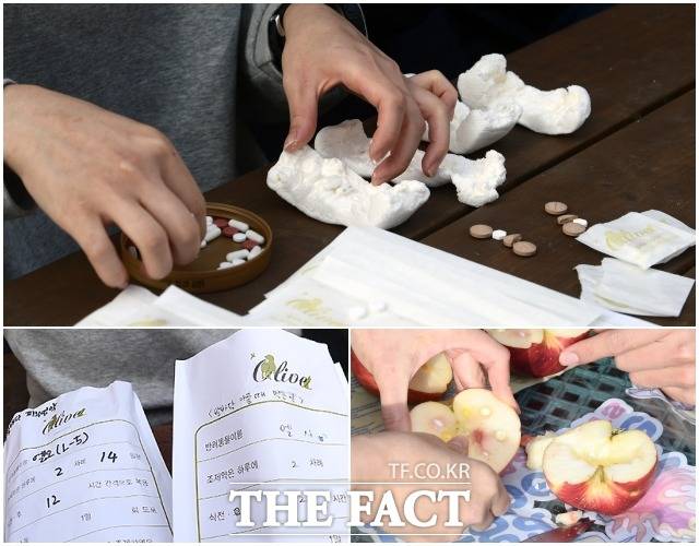 활동가들이 마시멜로와 사과에 약을 넣은 간식을 만들고 있다. 노령인 곰들이 먹을 약은 영양제와 관절염약, 항생제 등이다.