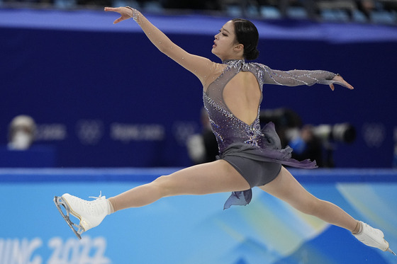 You Young performs a split jump in the women's figure skating short program at the 2022 Winter Olympics on Tuesday at Capital Indoor Stadium in Beijing. [AP/YONHAP]