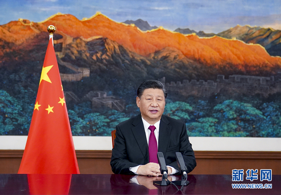Chinese President Xi Jinping delivers an address to the World Economic Forum in January via video. [XINHUA]