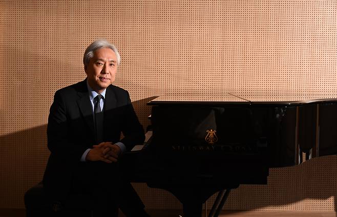 Kim Dae-jin, president of K-Arts, poses for photos during an interview with The Korea Herald on Monday. (Im Se-jun/The Korea Herald)