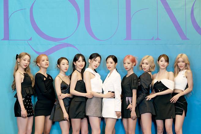 Cap/ Girl group WJSN poses for photos during a press conference for its fourth special single, “Sequence,” on Tuesday in Seoul. (Starship Entertainment)