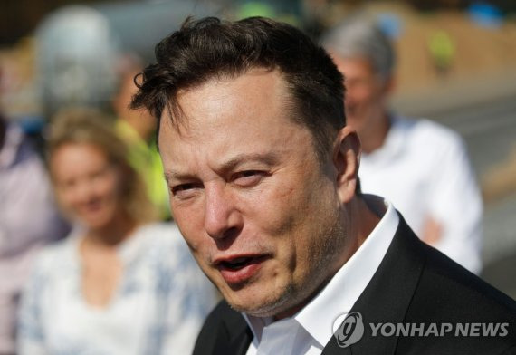 (FILES) In this file photo taken on September 3, 2020 Tesla CEO Elon Musk talks to media as he arrives to visit the construction site of the future US electric car giant Tesla, in Gruenheide near Berlin. - The court battle between Elon Musk and Twitter kicked off on July 19, 2022, as the social media firm tries to force the entrepreneur to honor their $44 billion buyout deal. The first hearing will center on Twitter's push to set a trial date for as early as September in a case that has massive stakes for both parties. (Photo by Odd ANDERSEN / AFP)