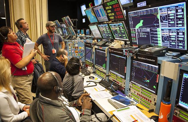 The US military, NASA, and Jet Propulsion Laboratory members observe NASA`s low-density supersonic decelerator (LDSD) test vehicle trajectory after its launch from U.S. Navy`s Pacific Missile Range Facility in Kauai, Hawaii. (File Photo - US Indo-Pacific Command)
