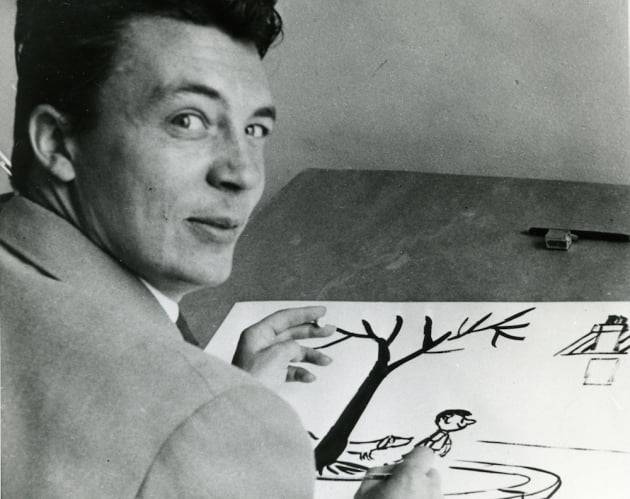 젊은 시절 장자크 상페의 모습. 책상 위에는 작업 중인 '꼬마 니콜라' 그림이 보인다. /출처: '꼬마 니콜라' 공식 홈페이지