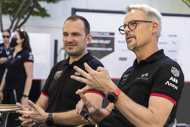 Porsche Motorsport Vice President Thomas Laudenbach (right) and Director Factory Motorsport for Formula E Florian Modlinger (left) speak during an interview with Korean media at Jamsil Sports Complex, Seoul, Friday. (Porsche Korea)