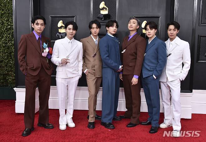 FILE - BTS arrives at the 64th Annual Grammy Awards on April 3, 2022, in Las Vegas. The group says they are taking time to focus on solo projects. The seven-member group with hits like “Butter” and “Dynamite” talked about their future in a video posted June 14, celebrating the nine year anniversary of their debut release.  (Photo by Jordan Strauss/Invision/AP, File)