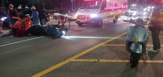 오토바이 사고가 난 부산 해운대구 올림픽동산 삼거리 앞 도로. 연합뉴스 제공
