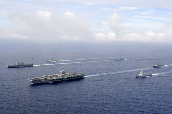 The U.S. nuclear-powered aircraft carrier USS Ronald Reagan, second from left, and South Korea's landing platform helicopter ship Marado, left, sail during a joint military exercise at an undisclosed location on June 4. [DEFENSE MINISTRY]