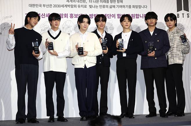 BTS poses for a picture at the group's appointment ceremony as honorary ambassadors for the 2030 Busan World Expo at Hybe's headquarters in Seoul on July 19. (Yonhap)