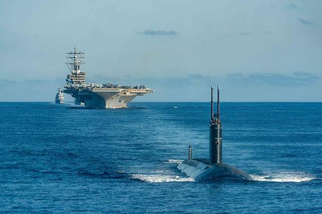 The US Navy’s Ronald Reagan aircraft carrier and the USS nuclear-powered submarine USS Annapolis participates in a trilateral anti-submarine warfare exercise between South Korea, the United States and Japan in the East Sea on Sept. 30, 2022. (US Navy)