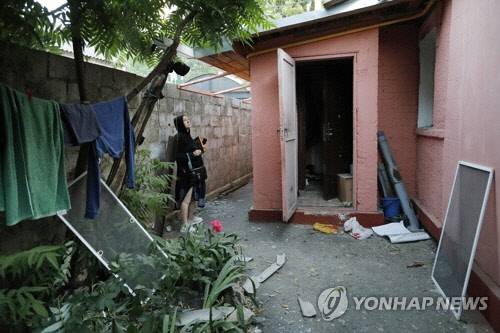 지난 7월 우크라 측의 폭격 피해를 주장하는 러시아 남부 벨고로드의 한 주택[TASS=연합뉴스 자료사진]
