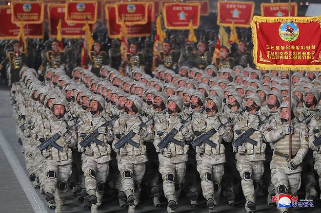 North Korean soldiers march during a military parade at Kim Il Sung Square in Pyongyang on the night of Feb. 8, 2023, to mark the 75th founding anniversary of the Korea People`s Army, in this photo released by the North`s official Korean Central News Agency. North Korean leader Kim Jong-un attended it. (Yonhap)