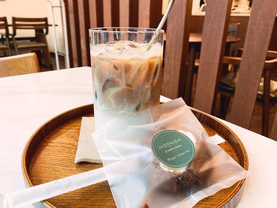 A cup of coffee with a vegan cookie at Warm Harue near Korea University in Seongbuk District, central Seoul [ISABELLE PIA SISON]
