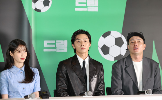 Director Lee Byeong-heon and the cast of "Dream" at a press conference for the film on Monday at Megabox Coex, southern Seoul. From Left, singer and actor IU, actor Park Seo-joon and director Lee Byeong-heon [YONHAP]