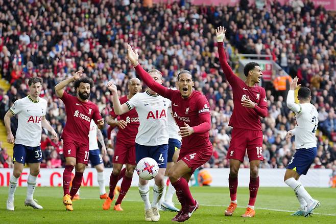 Liverpool's Virgil van Dijk, centre, Mohamed Salah, 2nd left and Cody Gakpo 2nd right, protest during an English Premier League soccer match between Liverpool and Tottenham Hotspur at Anfield stadium in Liverpool, Sunday, April 30, 2023. (AP Photo/Jon Super)







<저작권자(c) 연합뉴스, 무단 전재-재배포 금지>