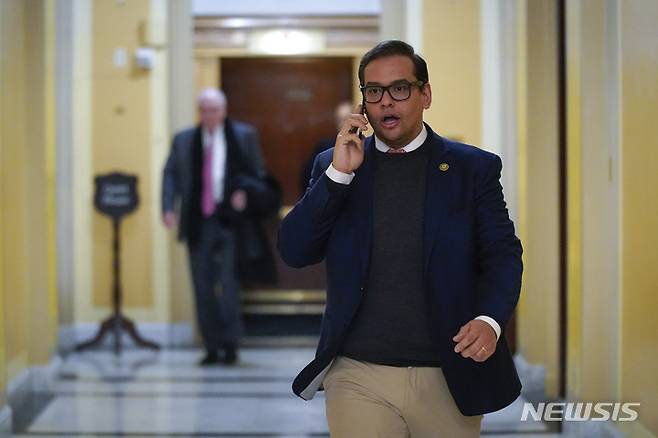 Rep. George Santos, R-N.Y., departs Capitol Hill in Washington, Wednesday, Jan. 11, 2023. (AP Photo/Patrick Semansky)