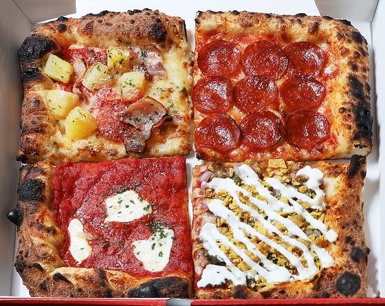 Pizza slices sold at The Slice Pizza [PARK SANG-MOON]